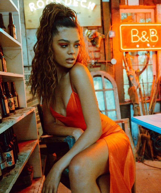 woman in orange dress wearing pls London hair pony