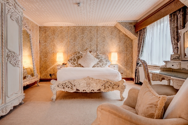 luxury suite with cream ornate decor