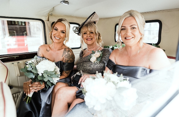 Bridal party in wedding car