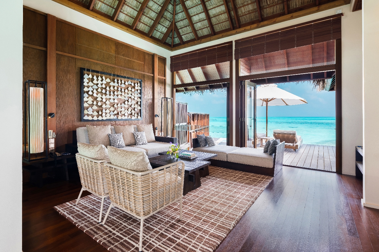 lounge of water bungalow sea views to decking and own pool