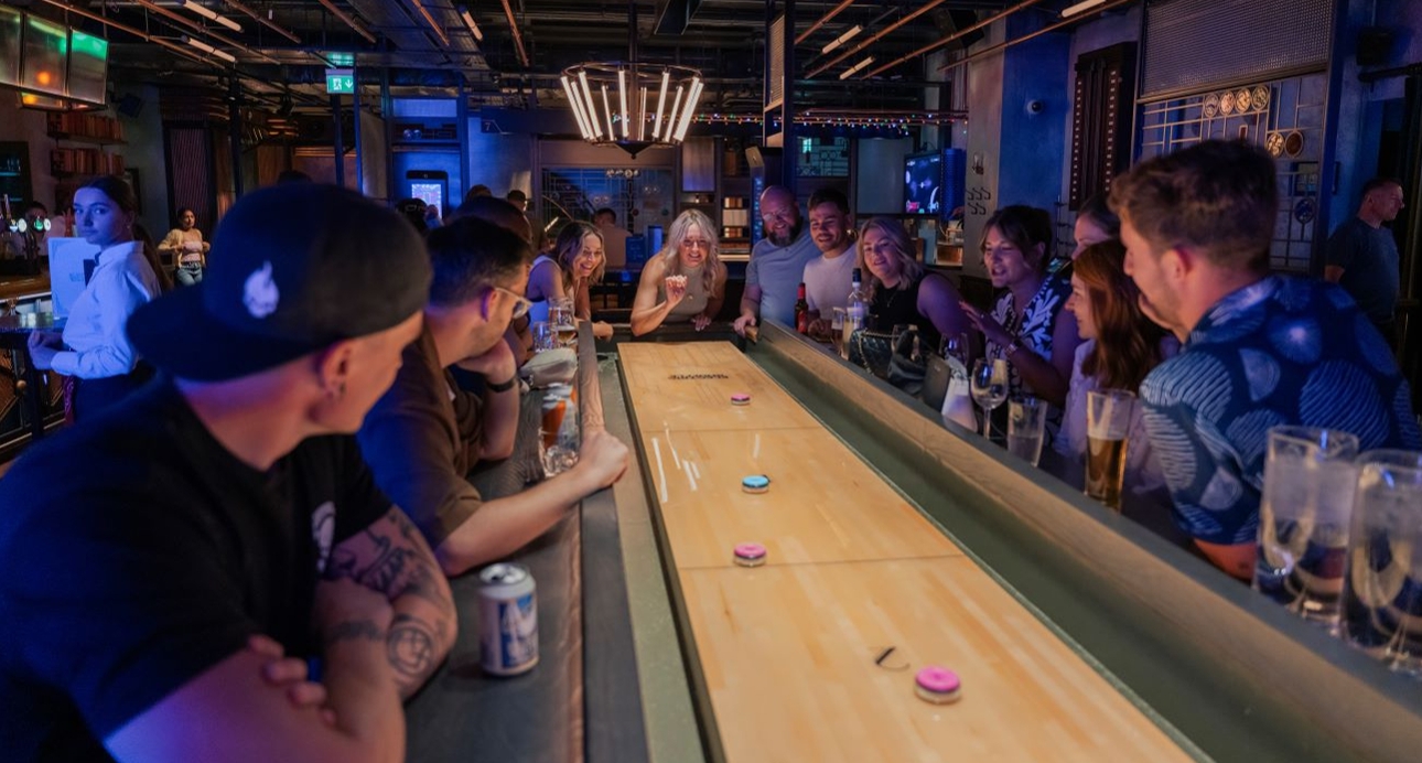 hen party in a bar with a shuffleboard