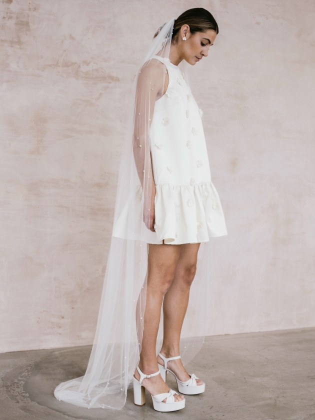 woman in short white dress and platform heels 