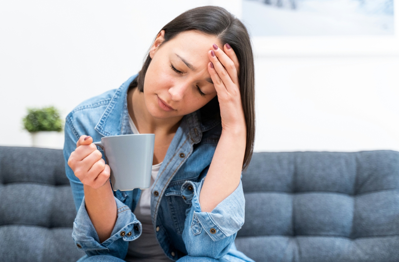 woman with hand on head