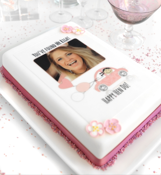 Square white cake with a photo of a person for a hen do