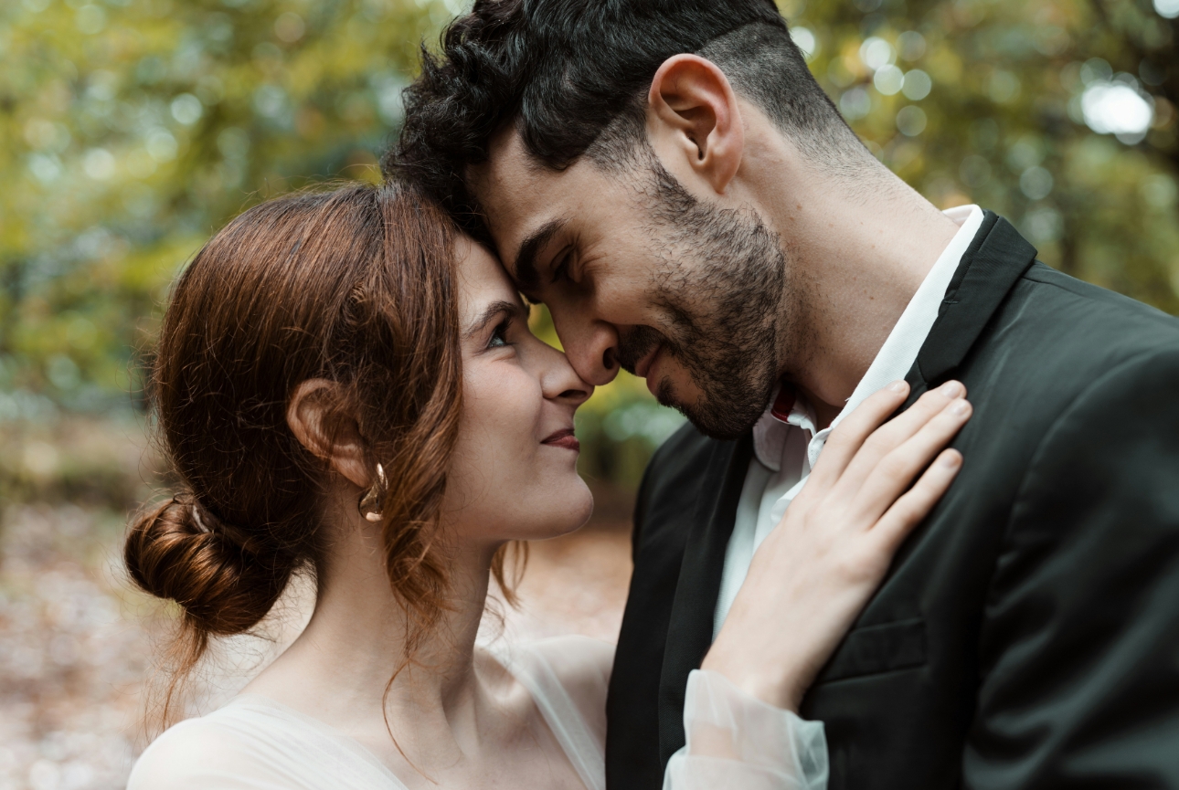 bride and grooms embracing