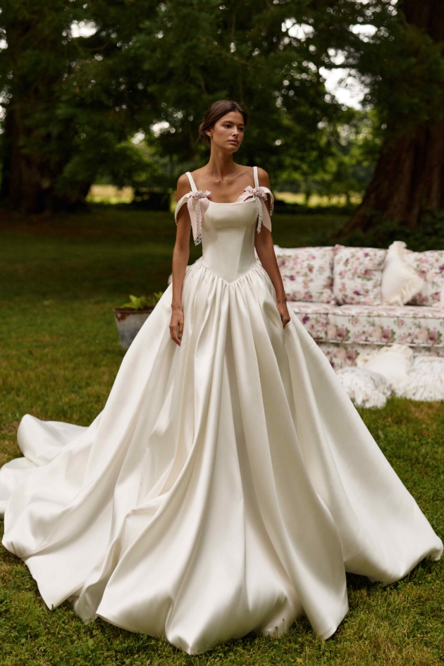 moden in corset princess ball gown with bows on straps