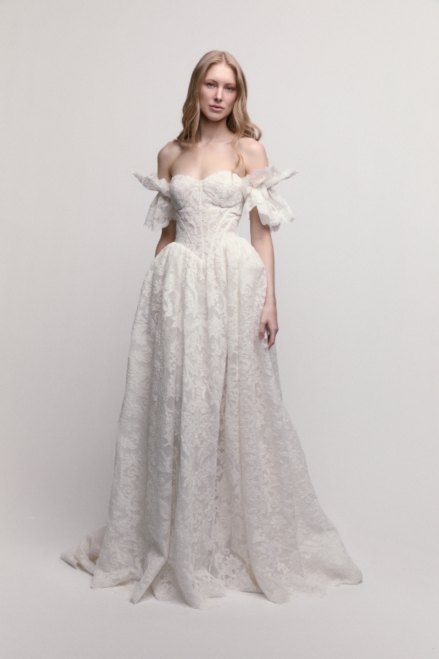 Rothenburg lace dress with a drop-basque waist and a sculpted sweetheart neckline creating a long torso and a voluminous skirt 